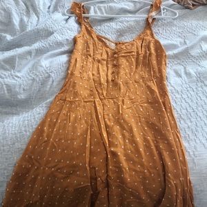 yellow and white polka dot dress